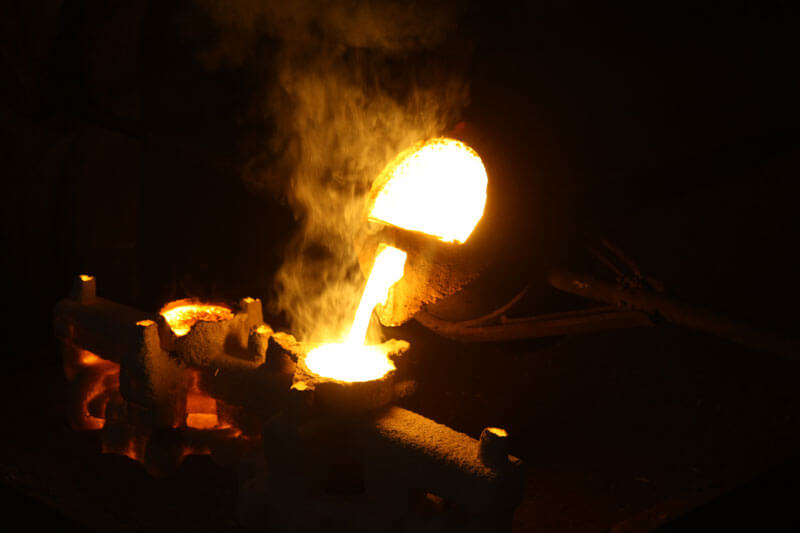 Molten metal being poured in a foundry
