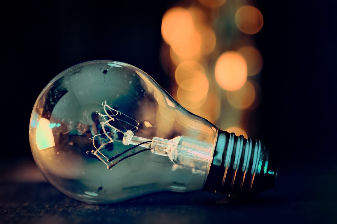 Electric bulb on colourful background
