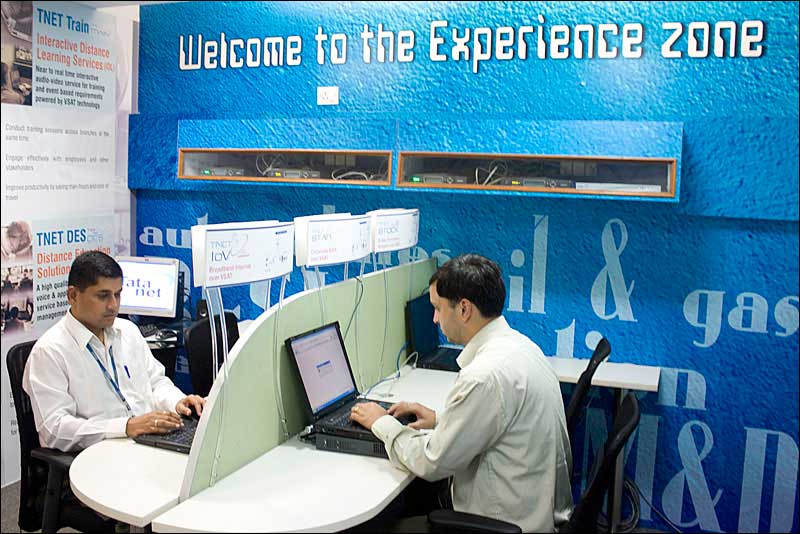 Photograph of two executives working on computers