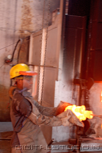 Photograph of  Worker with molten iron