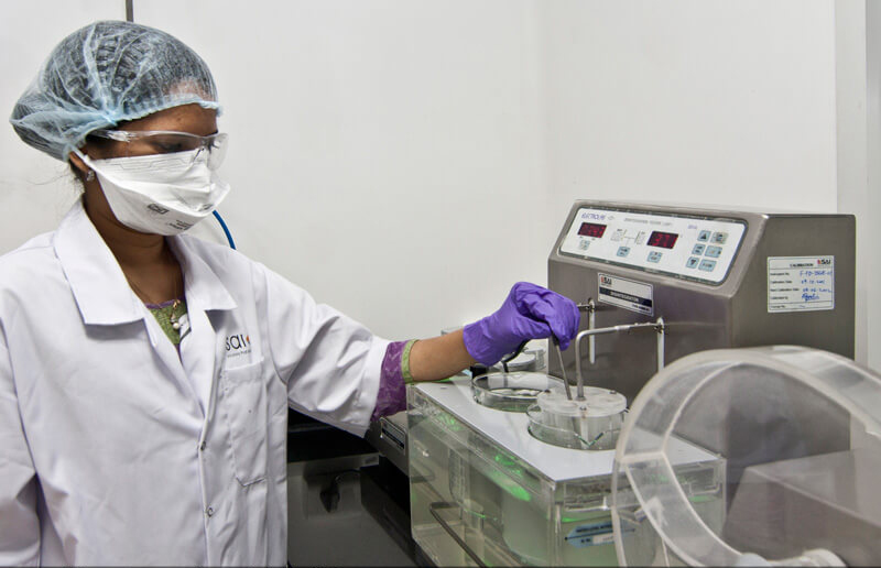 Lady lab technician working inside a pune pharma plant