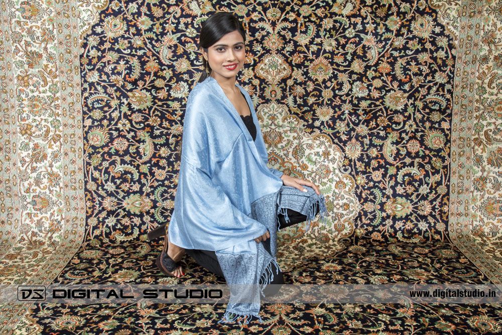Model with Pashmina on a handmade oriental carpet