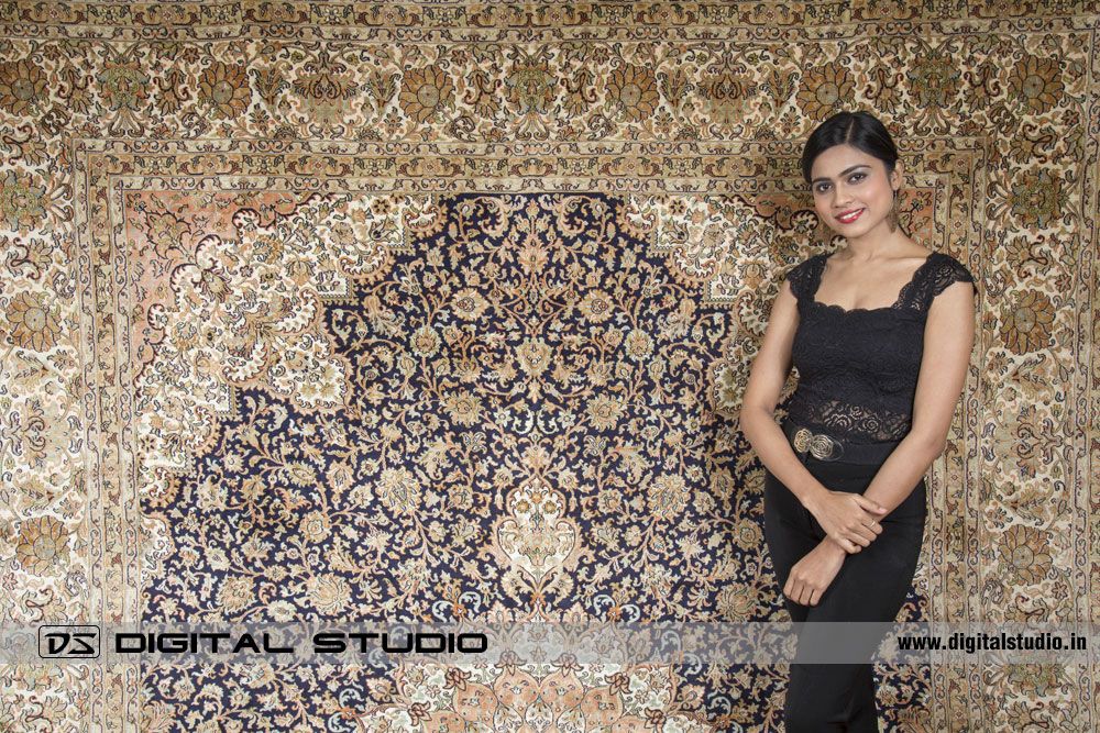Silk carpet with model wering black dress