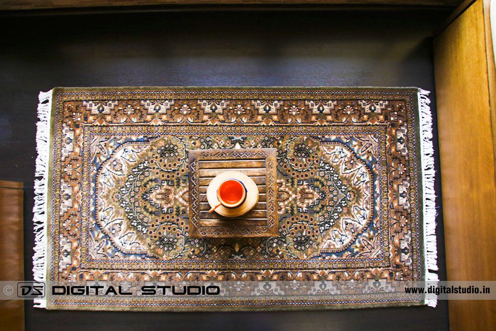 Top view of oriental hand made carpet on wood floor