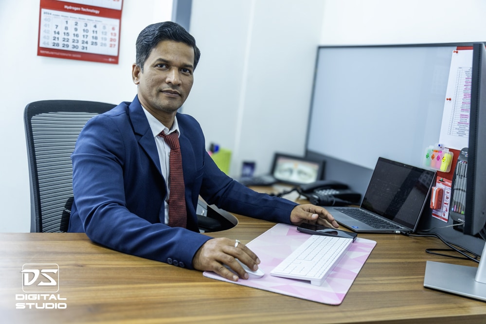 Smiling young executive at his desk