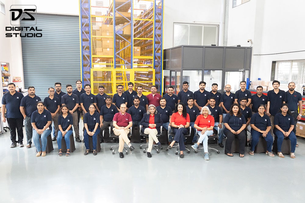 Management and technicians seated in a group shot